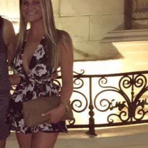 Lulu's Black Floral Halter Romper with White Flowers